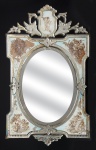 Belíssimo e raro espelho veneziano dos anos 40 todo decorado com " Anjos e Querubins", ricamente emoldurado. Med.: 102 x 62 cm.