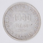Lote composto por uma moeda de 1000 Réis, cunhada em 1911, Ordem e Progresso X GRAMAS.