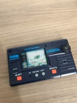 Mini Game Masudaya Corp Mechaborg com radio AM. Radio não testado. Display funcionando. Japan.