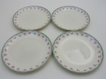 Quatro pratos em porcelana, CORONA. Diâmetro 25,5 cm.