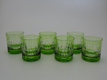 Seis copos de cristal lapidados na cor verde, altura  9 cm.