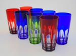 Oito copos em cristal  colorido , lapidados a mão. Altura 14 cm.