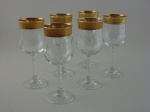 Seis taças de cristal Frances com decoração a ouro. Altura 19  cm.