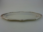 Travessa para peixe em metal prateado  Fracalanza.  Comprimento 62 cm, largura 24 cm.