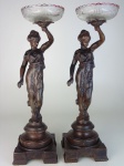 Par de esculturas em petit bronze com cristal prensado. Altura 50 cm.