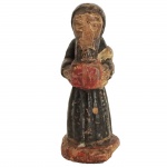 Imagem em madeira policromada representando Santo. Brasil, Séc. XIX. 6 cm de altura.