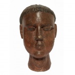 Ex-voto em madeira representando cabeça de homem. 25 cm de altura.