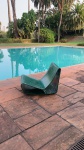 WILLY GHUL. ESPRIGUIÇADEIRA PARA PISCINA, MODELO LOOP, COM MOVIMENTO DE BALANÇO. MOLDADO EM AMIANTO. 55 CM X 57 CM DE ALTURA. DÉCADA DE 1970. 80 X 60 X 55 CM. NOTA: Willy Guhl é considerado o verdadeiro pioneiro do design industrial suíço. Ele é conhecido em todo o mundo pela criação de uma série de projetos para a Eternit, cadeiras de piscina e jardineiras únicas na história do design de móveis. Atenção: É preciso dizer que o fato da matéria prima ser o amianto esse produto não causa dano algum a saúde o dano do amianto é o do processamento, quanto moldado não traz risco haja visto ser o material majoritariamente predominante nas caixas de água dos brasileiros.