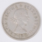 Lote composto por moeda do Reino Unido de 1 Shilling cunhada em 1955..