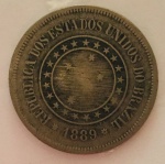 Moeda 100 Reis, República dos Estados Unidos do Brasil Imperial, cunhada em 1889.