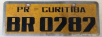 Placa automotiva BR 0787 - Curitiba - Paraná - inox - 13 x 35 centímetros com cantos arredondados - apresenta sinais de uso e tempo