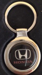 Chaveiro temático HONDA - metal medindo 7 centímetros - sem uso na caixa original.