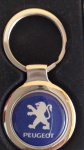 Chaveiro temático PEUGEOT- metal medindo 7 centímetros - sem uso na caixa original.