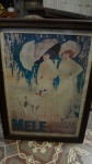 Quadro emoldurado em madeira  com reprodução de  propaganda da  bele epoque. (desgastes) med.: 78 x58 cm.