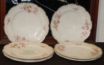 Lote com 06  pratos  em fina  porcelana  decorada.