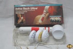 Massageador infra-tech ultra, na caixa com acessórios.