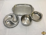 Lote composto de 4 peças em aço inox, sendo 2 bowls, 1 petisqueira e 1 bandeja retangular. Medindo a bandeja 33,5cm x 23,5cm.