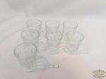 7 copos para cachaça em vidro translúcido. Medindo: 4cm de diametro x 5cm de altura.