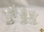 Jogo de 9 taças em cristal com lapidação Saint Louis. Medindo 3 de vinho do porto 8,5cm de altura e 6 de licor 6,5cm de altura.