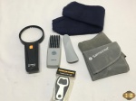 Lote composto de abridor de garrafa, lupa com led, pente, etc. Medindo a lupa 19cm de comprimento