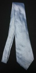 ZARA MAN -  Gravata em seda no tom azul claro, com pequenas estampas geométricas em marrom. +