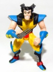 X MEN - TOY BIZ - Figura articulada em vinil do personagem Wolverine da série X-Men, peça original Toy Biz. Medindo 11cm de altura.