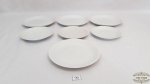 7 pratos diversos  sobremesa de porcelana branca. Medidas: maior 18cm diâmetro , menor 15cm diâmetro.