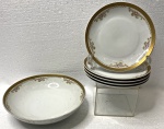 SCHMIDT- lote contendo 4 pratos de sobremesa e um prato fundo de porcelana com bordas douradas