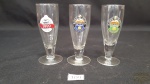 3 calices de aperitivo com logo  de cervejas.Medidas: 11 cm altura 4 cm  diâmetro.