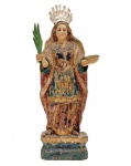 Santa Luzia dos Olhos - Imagem em madeira esculpida e policromada. Acompanha resplendor em prata. Brasil. Séc. XIX. 28 cm (imagem). 31 cm (com o resplendor).