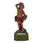 São Sebastião - Imagem brasileira em madeira policromada. Apresenta-se em tradicional postura, amarrado ao tronco. Peanha facetada e chanfrada. Séc. XIX. 13.5 cm. 