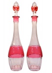 VAL SAINT LAMBERT - Par de licoreiros em cristal, ornamentado em facetas de "overlay" rosáceo sobre incolor. Bélgica. Séc.. XX. 43 cm.