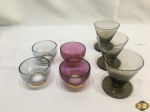 Lote composto de 7 copos de aperitivo em vidro colorido. Medindo o maior 8cm de altura.
