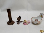 Lote de 4 castiçais, modelos e tamanhos diversos. Medindo o maior 13,5cm de altura.