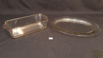 2 travessas em vidro  pirex..sendo 1 retangular ,1 oval rasa .Medidas: 27 cm de comprimento 14 cm de largura travessa retangular , prato oval 38 cm de comprimento 27 cm de largura.