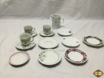 Lote composto de leiteira, 3 xícaras de café e diversos pires de café em porcelana, modelos diversos.