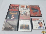 Lote de 8 cd's originais, composto de títulos nacionais e internacionais. Como Pavarotti, Pian Orquestra, etc.