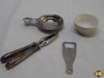 Lote composto de pequeno bowl, quebra nozes, abridor de garrafa e coador de chá.