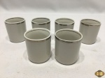 Jogo de 6 copos em porcelana Vera Cruz friso prata para suporte de xícara de café. Medindo 4,5cm de diâmetro x 5,5cm de altura.