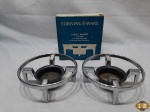 Par de fogareiros da Corning Ware em aço. Medindo 14,5cm de diâmetro x 5,5cm de altura.