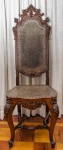 Cadeira trono Dom José, em couro pirogravado, com detalhes florais, pertenceu a Laudelino Freire, quando tomou posse na Liga de Defesa Nacional. 130 cm altura.