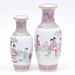 Dois vasos chineses da família rosa em porcelana decorada c/cenas do cotidiano em policromia, assinados. Alt. 25 e 30cm.