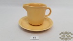 Cremeira em Ceramica Portuguesa Amarela. Medidas: pires 14cm diametro, caneca 8cm altura. Made in Portugal.