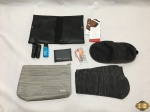 Lote composto de necessaire completa da America Airlines e necessaire da Tam.