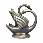 Antigo porta guardanapo em metal cinzelado e polido no formato de casal de cisnes. Pequenas marcas do tempo. Nada que tire a beleza do exemplar. Dimensões: 15 cm x 14 cm.