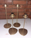 Quatro Castiçais de ferro comporta uma vela  Altura 28 cm