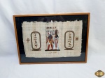 Papiro egípcio, com moldura em madeira e vidro frontal. Medindo a moldura 55,5cm x 40cm.