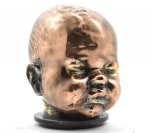 Escultura em Ferro com Banho de Cobre Moldado Figura de Face de Criança. Medida: 13 X 9 Cm. (Diâmetro da Base). Peso 1 Kg.