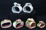 COLECIONISMO - Lote de 6 porta guardanapos em porcelana. Sendo 5 decoradas com flores. Maior 6 cm e menor 3,5 cm. bicados.