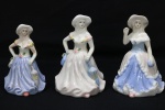 PORCELANA - Lote de 3 bonecas em porcelana policromadas estilo LLADRÓ, representando "Damas Antigas". Maior 12,5 cm e menor 11 cm.